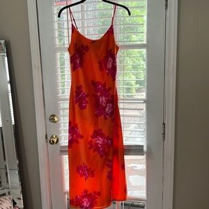 Fun slip dress with side slit. Orange with pink flowers